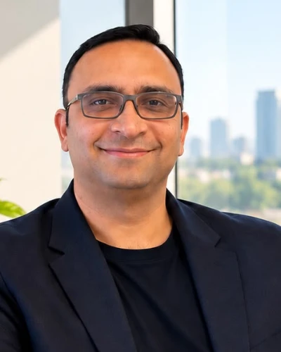 Anurag Pareek, SEO, AEO and GEO consultant, at his desk with a search performance dashboard on screen